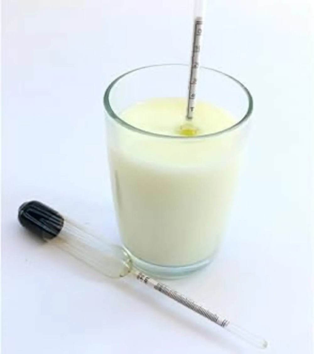 Lactometer in milk glass for checking purity and density