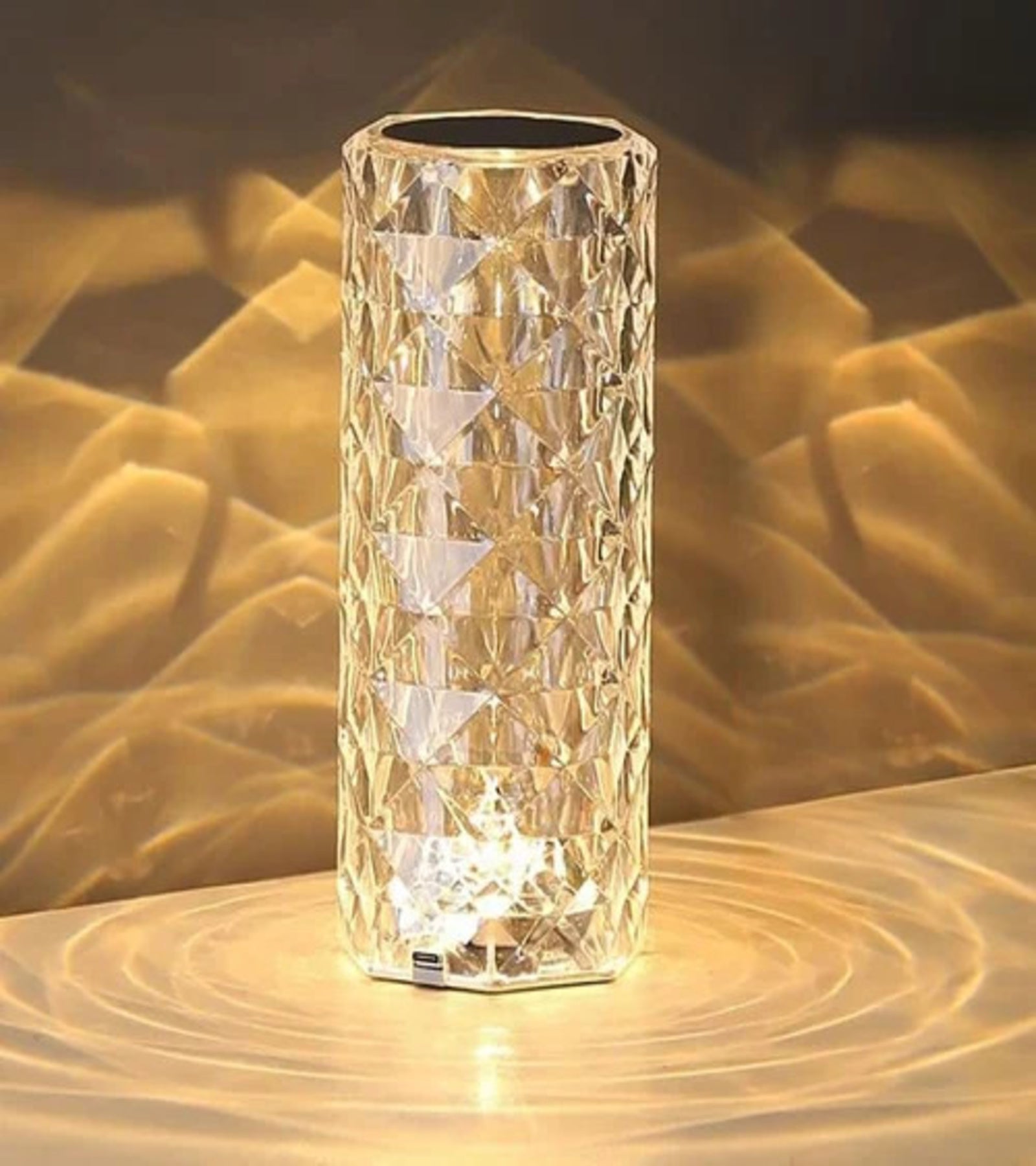 Crystal table lamp glowing with golden light

