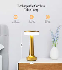 Rechargeable gold cordless table lamp with USB-C charging, placed on bedside table
